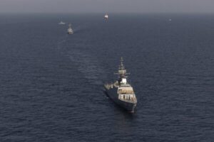 China warns US as its warship sails through South China Sea for second day